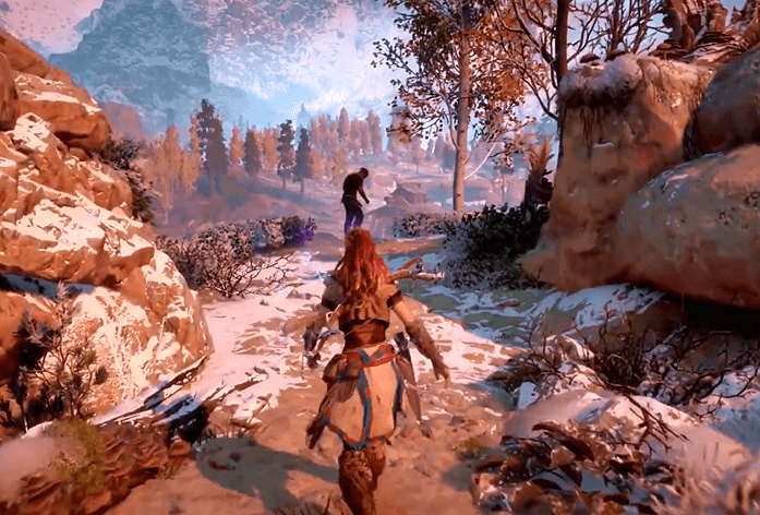 a screenshot of the game  Horizon Zero Dawn that shows Aloy walking towards another character who looks distressed and in need of help