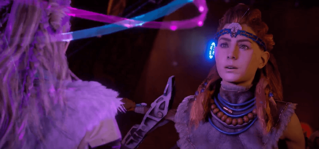 a screenshot of the game  Horizon Zero Dawn that shows Aloy looking in wonder at electric fields around a second character's head